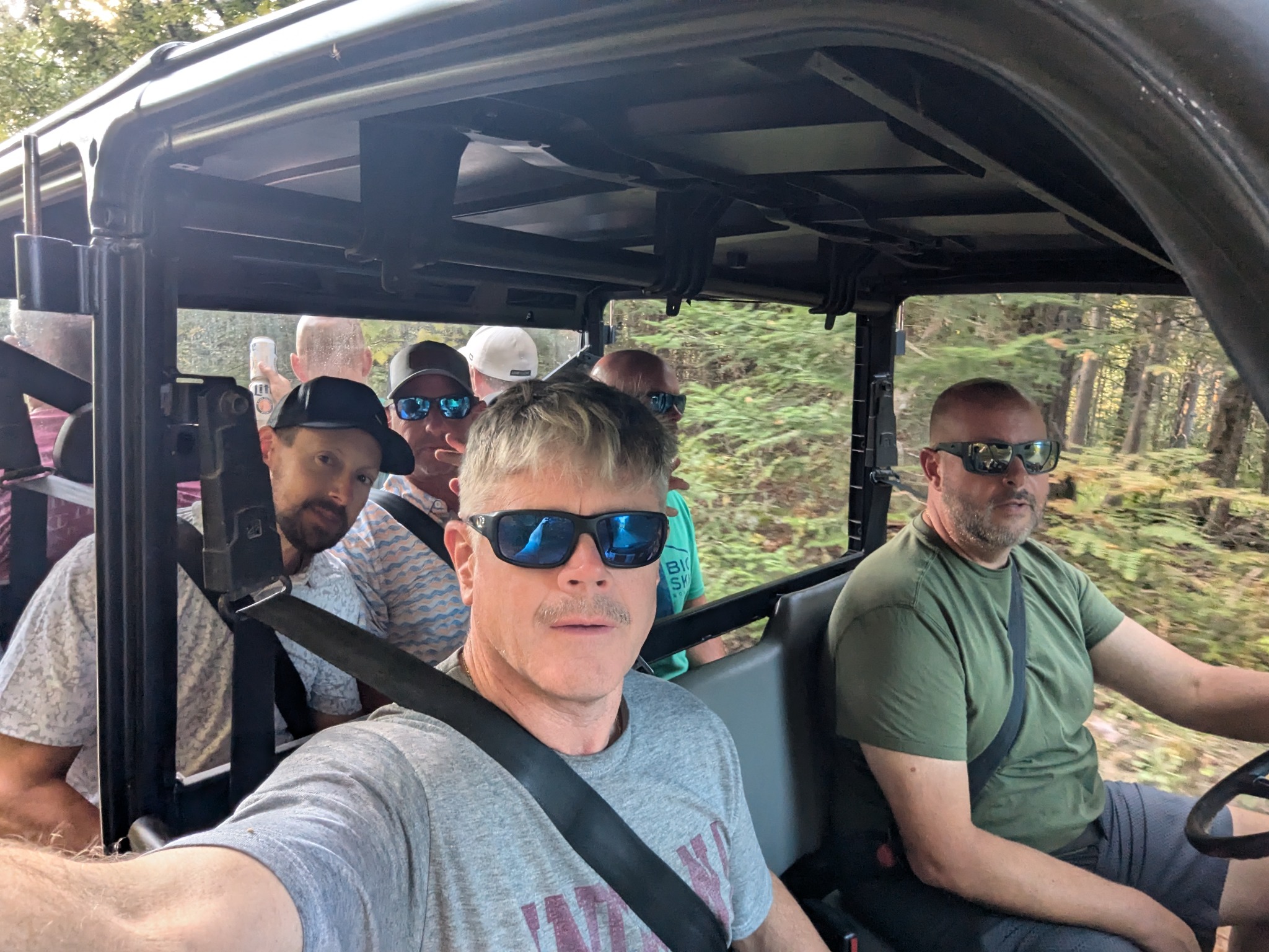 NNF 2024 crew riding in utility vehicle